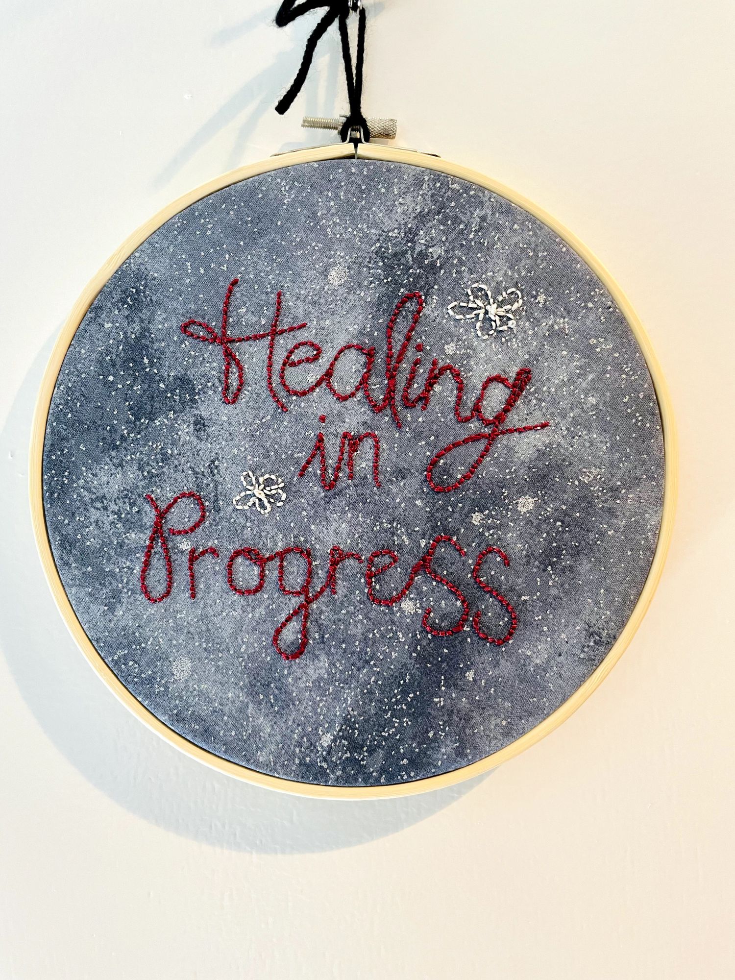 Embroidered hoop art reading Healing in Progress